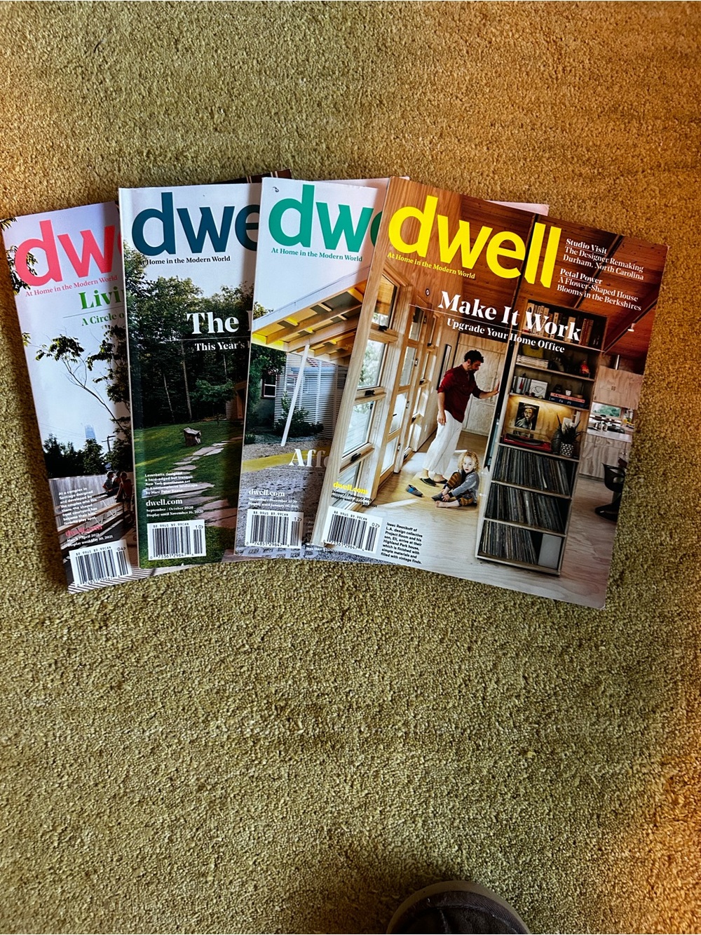 dwell Magazines with Yellow, Teal, Pink, Blue, Green Mastheads